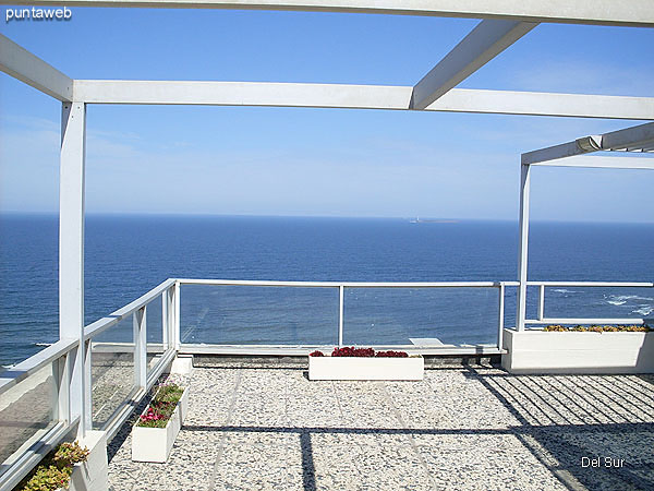 Department terrace partly covered and gated and equipped with table and chairs plastic chairs.<br><br>Accessed by spiral stairway in the living room.