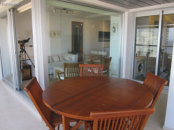 Detail wood dining table with six chairs.