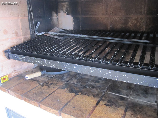 Barbecue next to the exit from the kitchen to the terrace balcony.