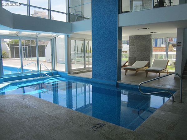 Building amenities: heated pool located to the north side of the building.<br><br>At the bottom of the image the outdoor pool for adults and outdoor pool for children are appreciated.