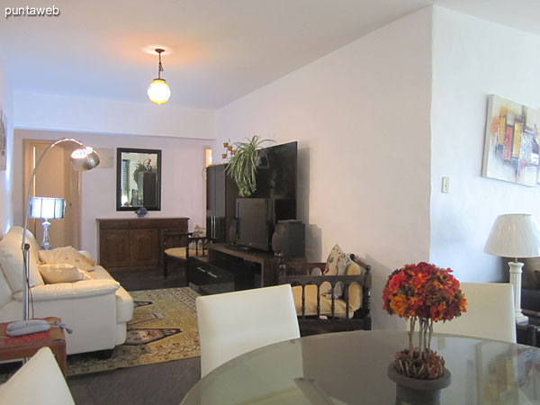 Detail of three bodies arranged sofa in the living room in front of the flat screen TV.