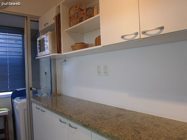 Kitchen. Fitted with low furniture and countertops.<br><br>It features an outdoor window in existing laundry space below on the north side of the building.