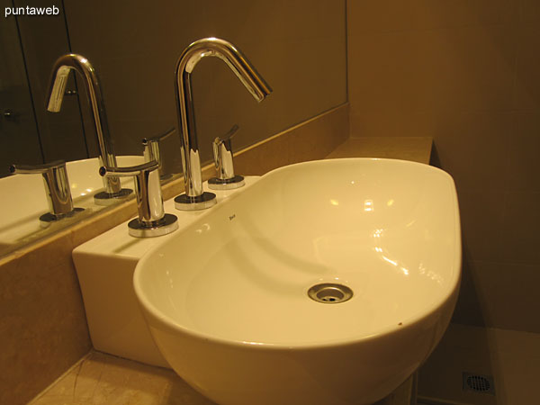 Detail of faucets and fixtures in the bathroom in the third bedroom suite.