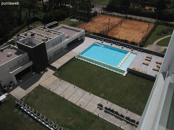 Heated pool. <br><br>Conditioned space with lounge chairs on wooden deck.