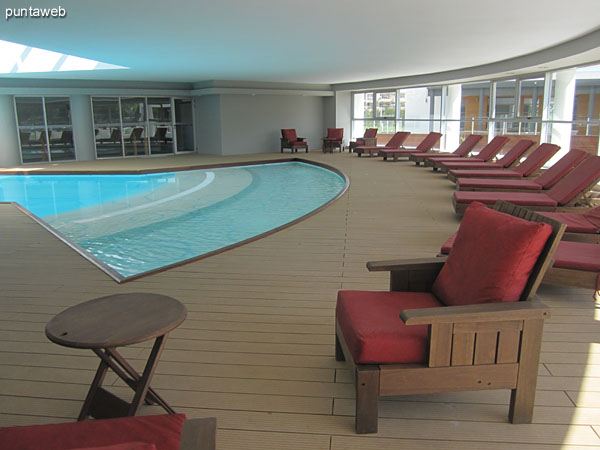 Heated pool. Located on the ground floor behind the lobby of the building. <br><br>Beautiful design on deck and take in natural light to the center.