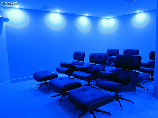 Microcinema. Decorated with deep blue lights, projection equipment of last generation six super comfy armchairs with footrest.