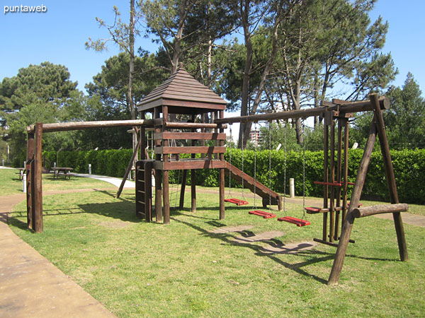 Garden with playground at the bottom of the building on the west side.