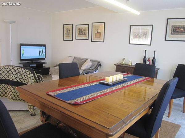 Important dining table. Located in front of the department on the south side.<br><br>Conditioned with six chairs.