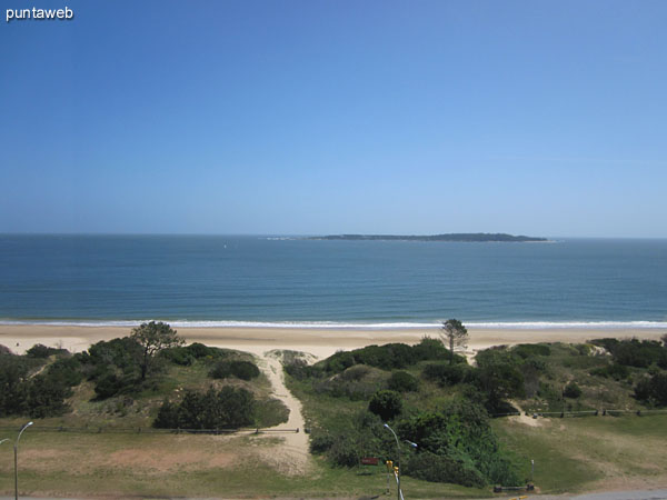 View from closed apartment balcony westbound at Playa Mansa.