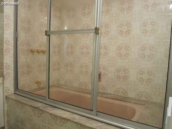 Detail of taps and sanitary ware in the bathroom in the second bedroom suite.