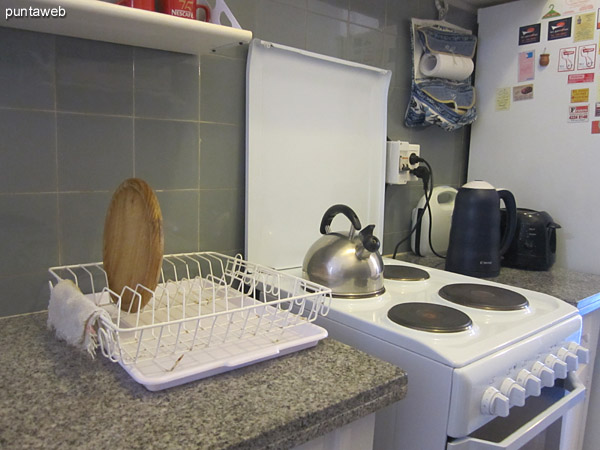 Kitchen. Complete with access to laundry outside. <br><br>It has counters and furniture on and under counter. <br><br>Equipped with electric cooker, microwave oven, toaster, boiler, among others.