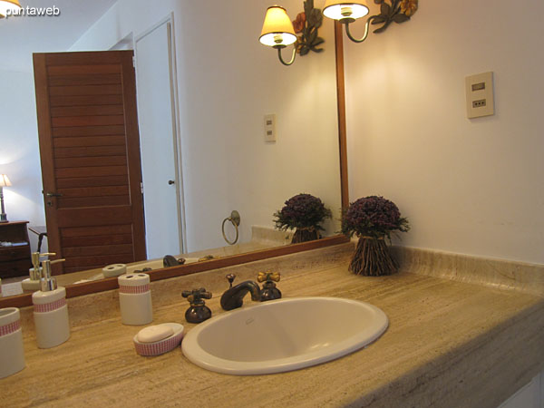 Detail closet in the master bedroom with en suite. <br><br>To the right of the image, vanity bath en suite.