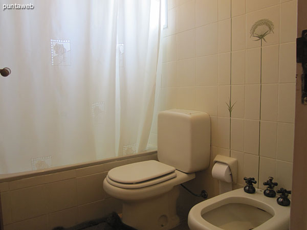 Detail of taps and sink vanity. <br><br>Large mirror taking up all the available width.