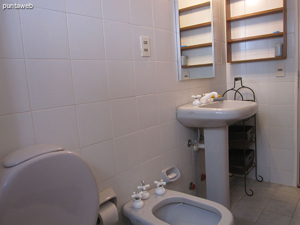 Detail of the shower and shower curtain in the bathroom shared between the second and third bedroom.