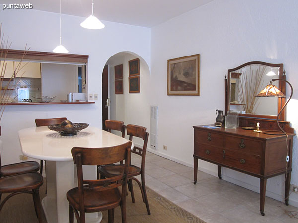 Dining space in the living room.<br><br>Conditioning with white lacquered oval table and six chairs in wood