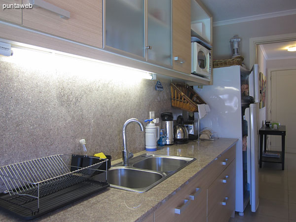 General view of the kitchen. Exterior, with access to laundry left and bottom of the image.<br><br>Equipped with low allowance and double sink furniture.