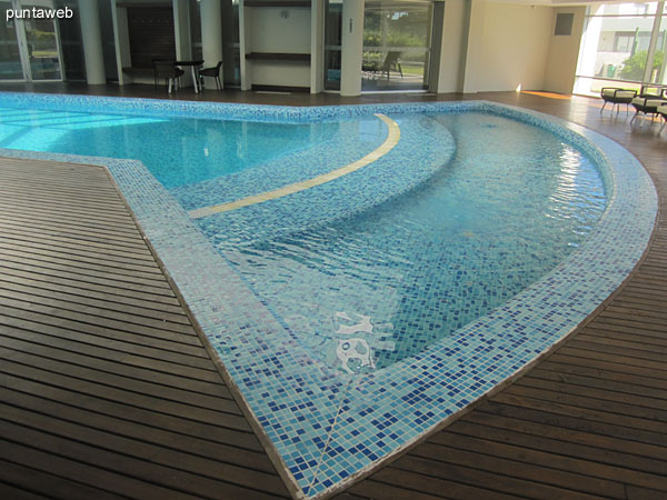 The heated pool is located in a gated complex with restricted access and equipped with sun room.