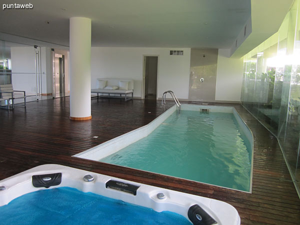 Heated pool in the corresponding to the apartment block. Located on the ground floor next to the lobby.<br><br>It features lounge chairs and a whirl.