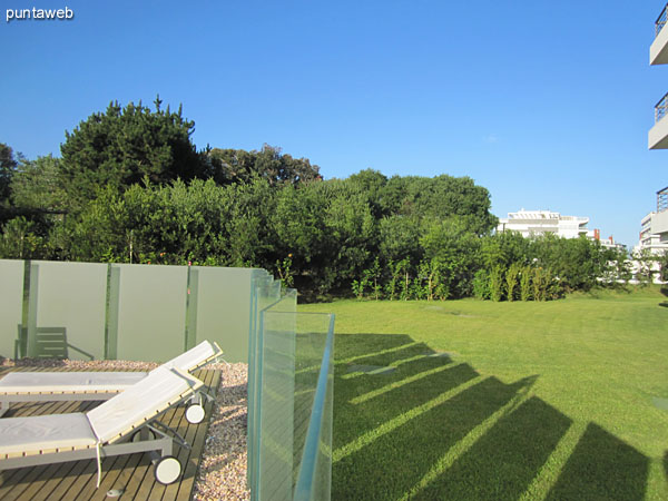 Space for chairs, umbrellas and chairs by the outdoor pool on the back of the building.