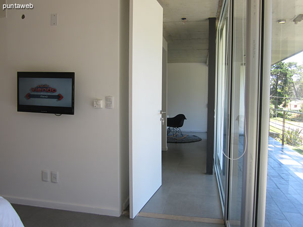 View of the master suite from the head along the closet to the entrance.