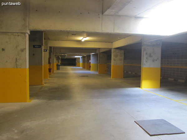 Overview of the garage in the basement of the building. the department has an exclusive space.