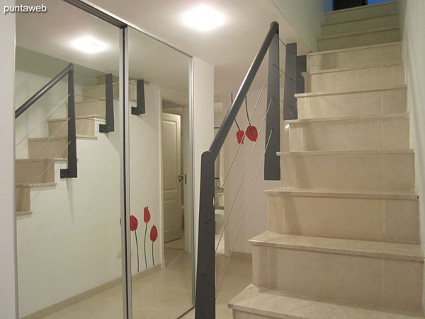 View from the kitchen to the front of the apartment on the enclosed balcony.