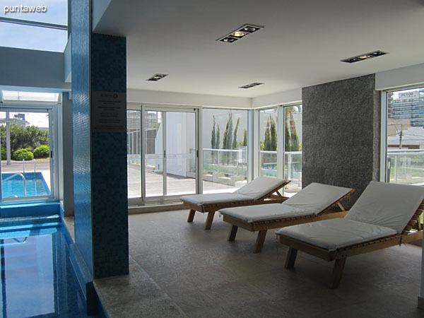 Loungers space in the environment of the heated pool.