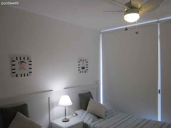 Second bedroom. Located in front terrace with access to the apartment balcony. Equipped with two single beds.