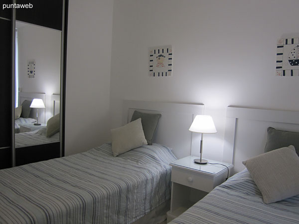 Second bedroom. Located in front terrace with access to the apartment balcony. Equipped with two single beds.