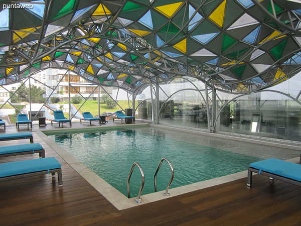 View from a balcony towards the sector of outdoor pools in the garden of the east side of the property.