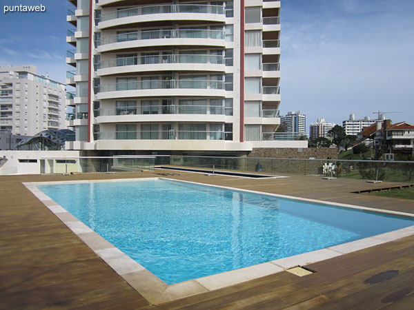 Building facade from the wooden deck where the outdoor pools.