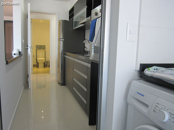 Laundry. Located below the kitchen to the front of the apartment with access to the terrace balcony of it.<br><br>Equipped with countertop and stainless steel sink and shelf allowance. It has washing machine.
