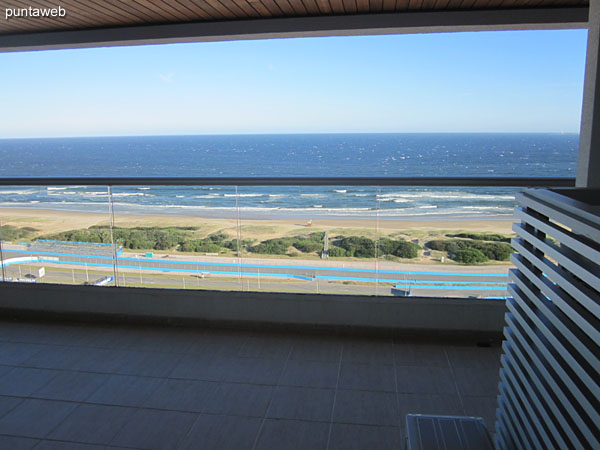 View along the kitchen into the apartment from the laundry.<br><br>In the background the toilet.