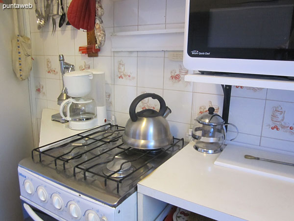 Kitchen. With access to the outside by door on the south side.<br><br>Equipped with counter with simple furniture on and under counter sink.