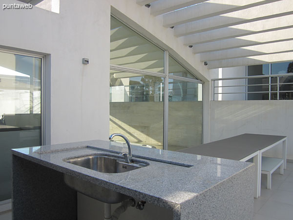 Outdoor grill next to the heated pool.