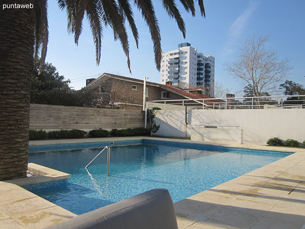 Outdoor pool. very sunny area located north side of the building and the property.