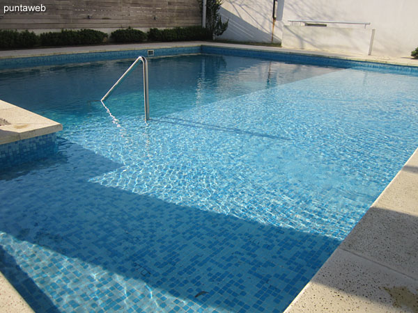 Outdoor pool. very sunny area located north side of the building and the property.