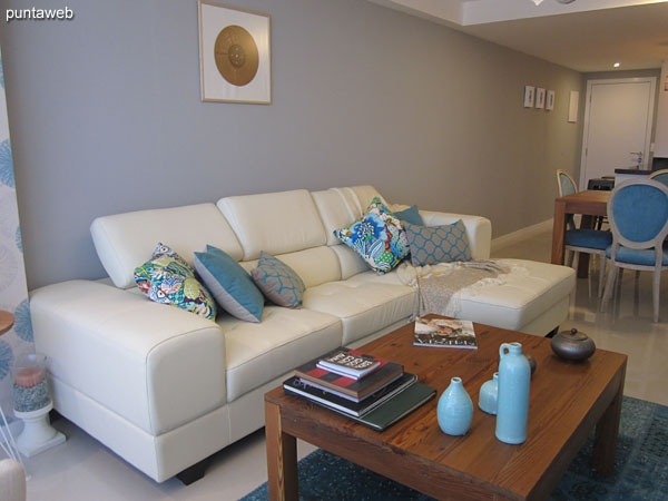 General view of living room space. American style kitchen.