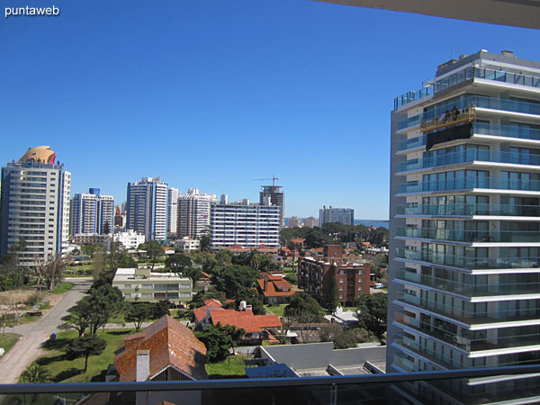 Northwest view on surroundings of neighboring buildings and residential neighborhood from the terrace balcony of the apartment.