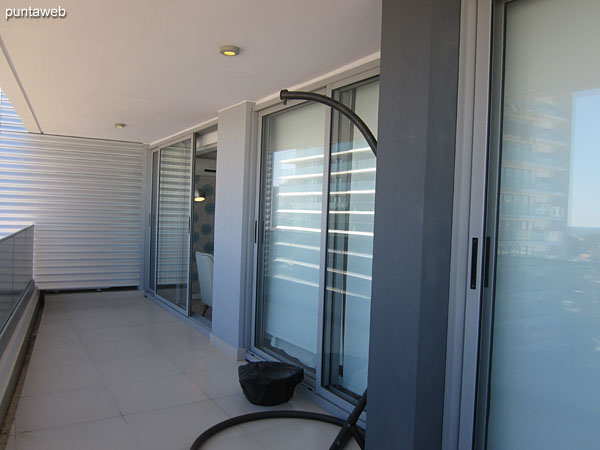 Southwest view on surroundings of neighboring buildings and residential neighborhood from the terrace balcony of the apartment.