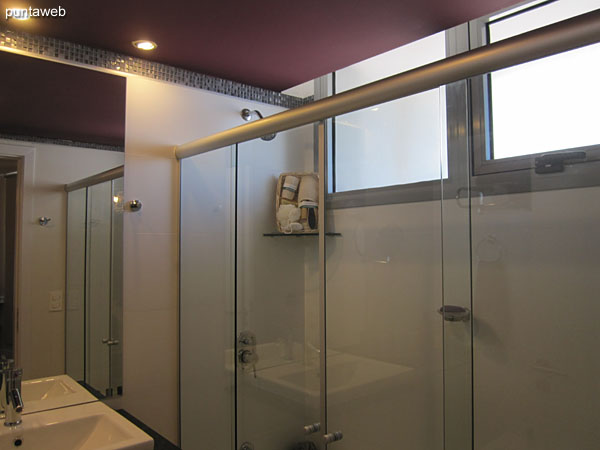 Detail of faucets and sanitary fixtures in the en suite bathroom.