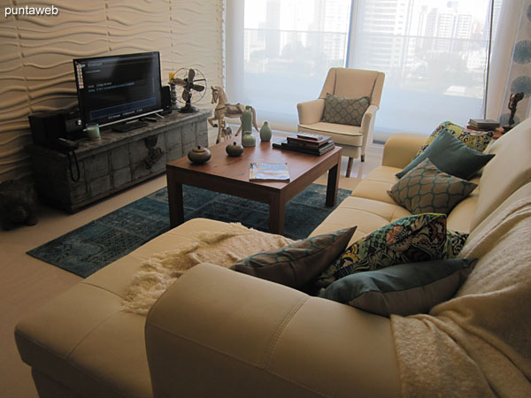 General view of the living room from the side end to the entrance.