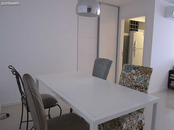 General view of the living room from the balcony access to the dining area next to the entrance to the apartment.