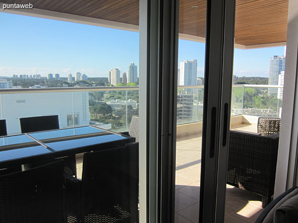 Dining space located the entrance of the apartment. Equipped with rectangular table with four chairs.