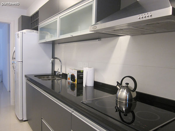 Kitchen, exterior, with separate utility room and access to balcony.
