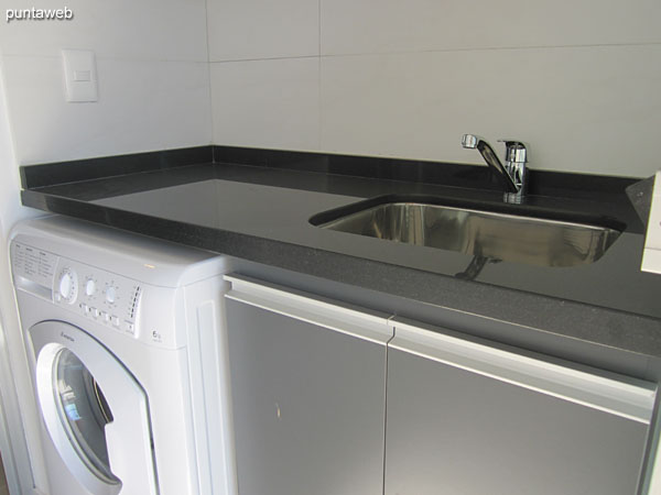 Countertops with stainless steel double sink.