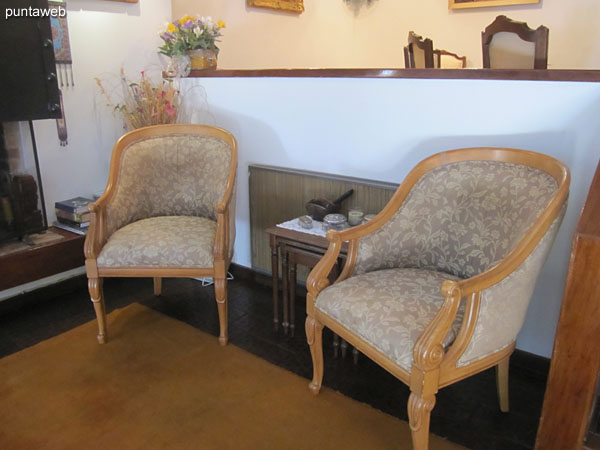 Individual chairs to the west side in the level space where the dining room is.