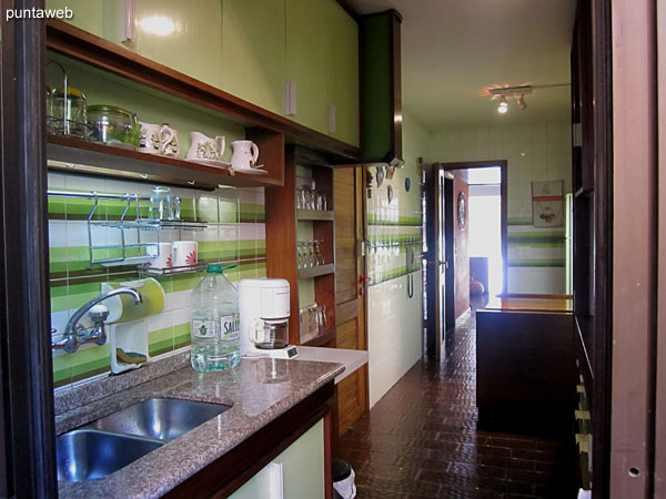 Detail of shelves on one side of the kitchen.