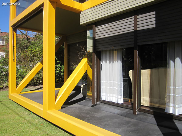 General view of the roofed and open balcony accessible from the living room and main suite of the apartment.