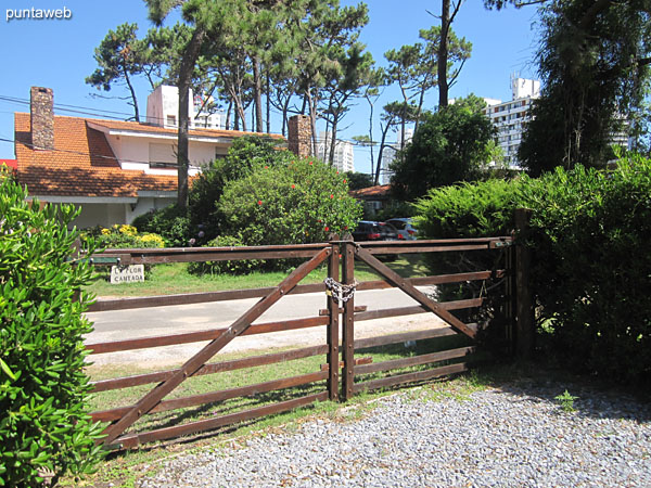 Garage space in the building building with access gate.